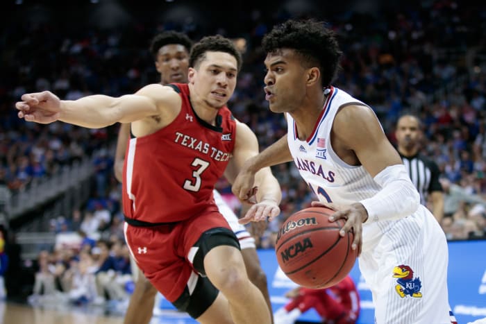 Mar 12, 2022; Kansas City, MO, USA; Kansas Jayhawks guard Remy Martin (11) drives to the basket during the second half against the Texas Tech Red Raiders at T-Mobile Center. Mandatory Credit: William Purnell-USA TODAY Sports